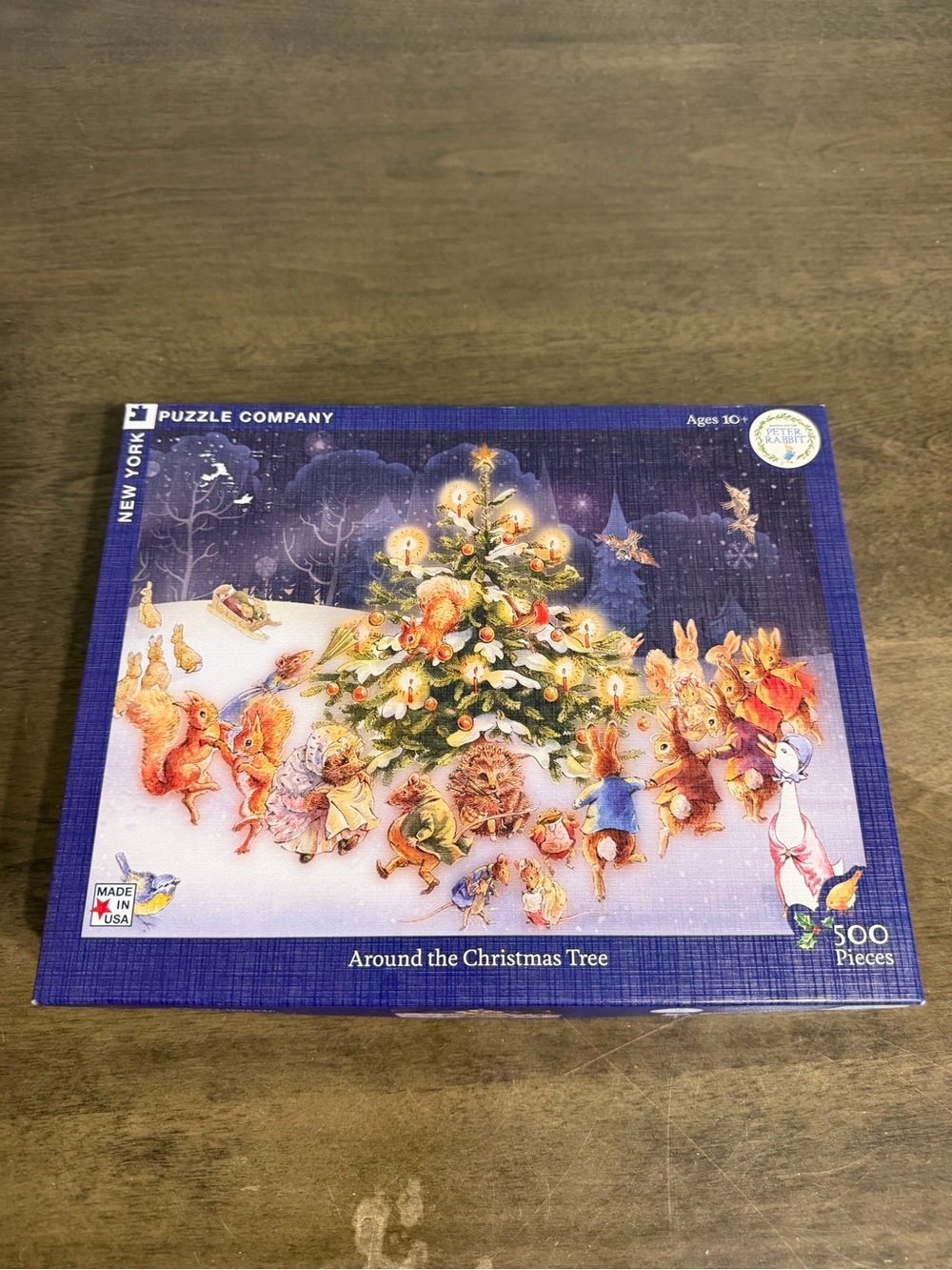 'New York Puzzle Company - Peter Rabbit "Around the Christmas Tree" - 500 pcs